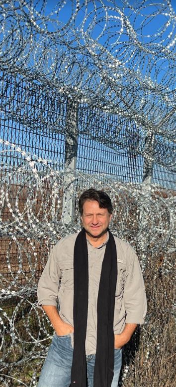 Bensman on the Serbian side of Hungary's border fence, December 2023